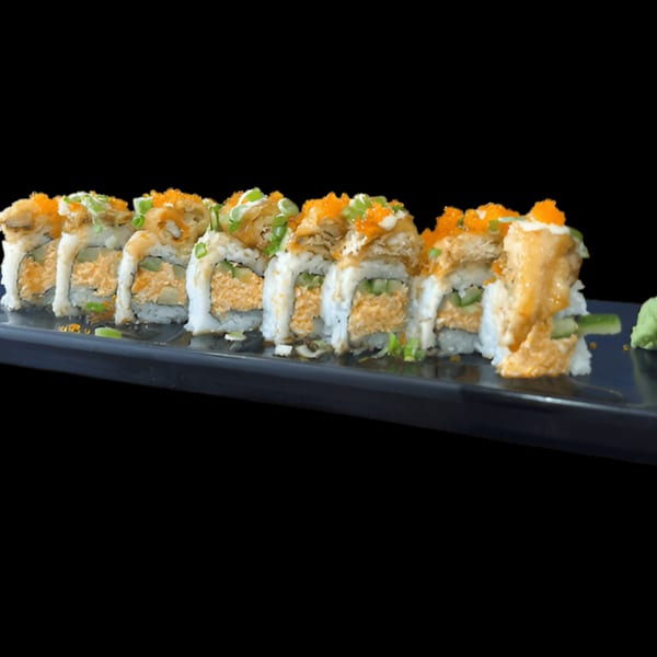 Akita Sushi Gourmet's sushi rolls with orange roe and green onions on a black plate.