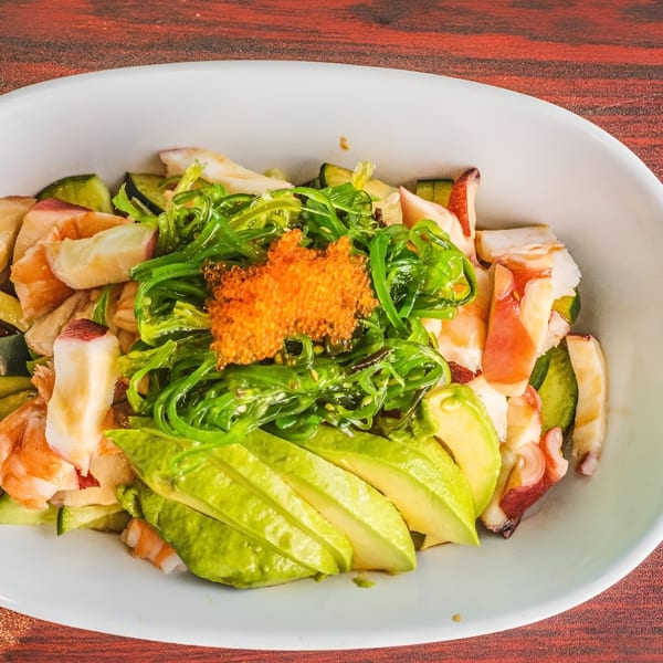 Akita Sushi Gourmet's seafood salad with seaweed, avocado, shrimp, octopus, and orange tobiko.