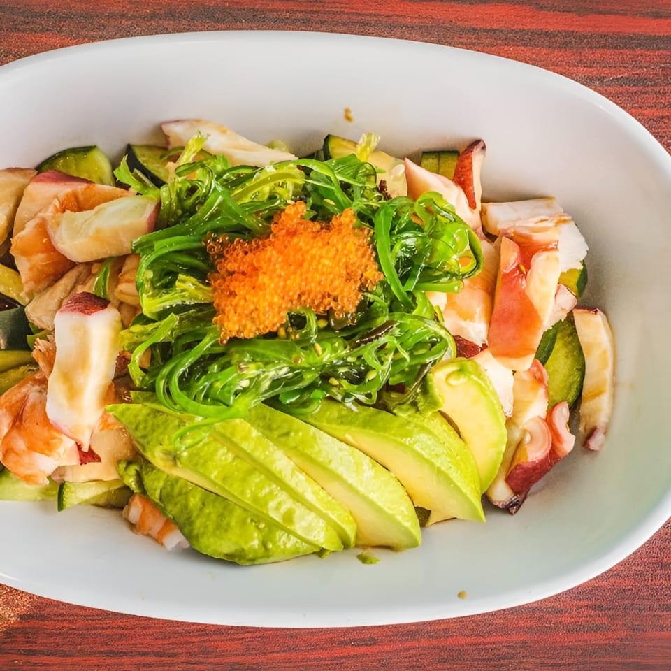 Akita Sushi Gourmet's seafood salad with avocado, seaweed, cucumber, and orange tobiko.
